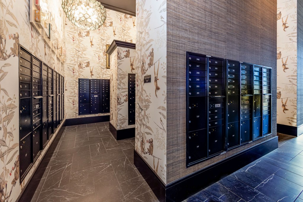 a locker room with rows of lockers and a chandelier