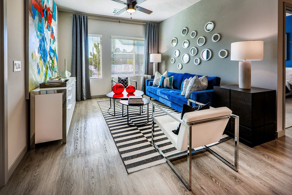 a living room with a blue couch