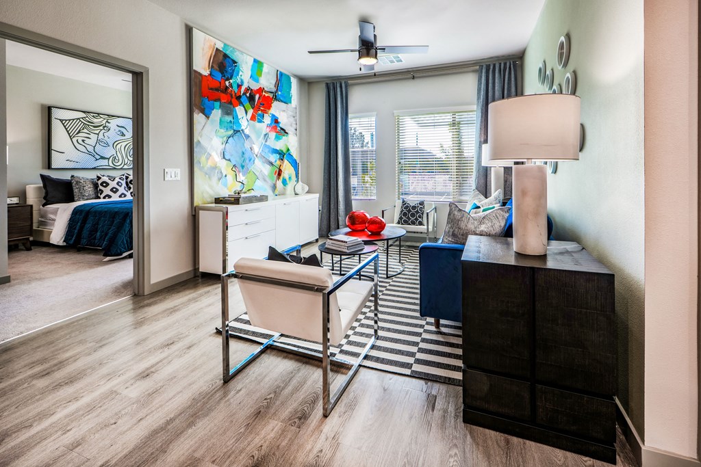 a living room with a couch and a chair and a table