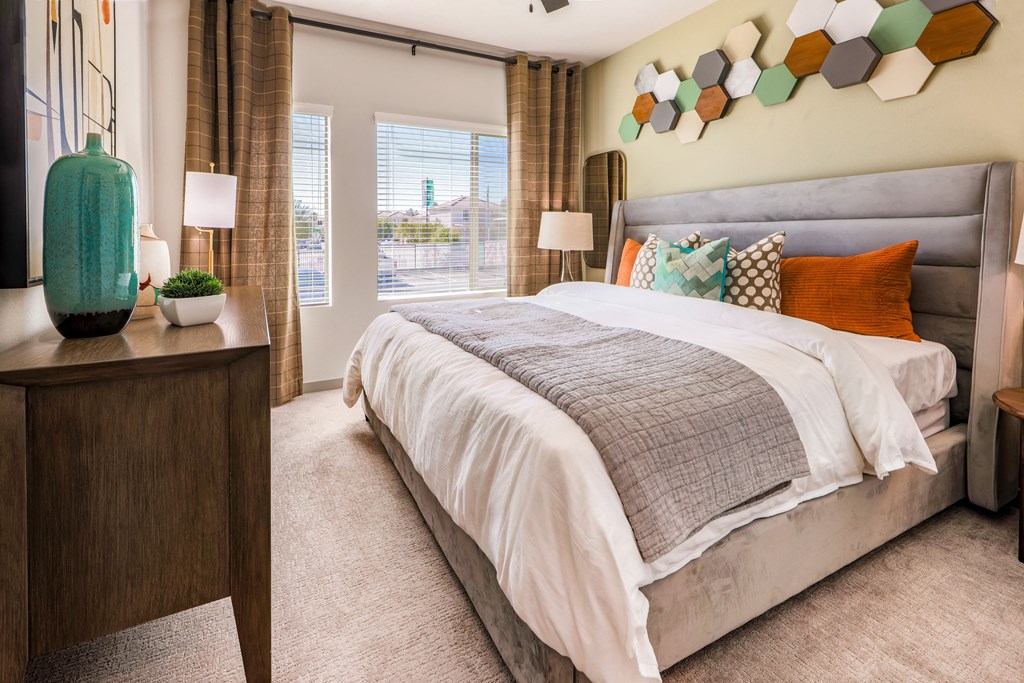 a bedroom with a bed and a window