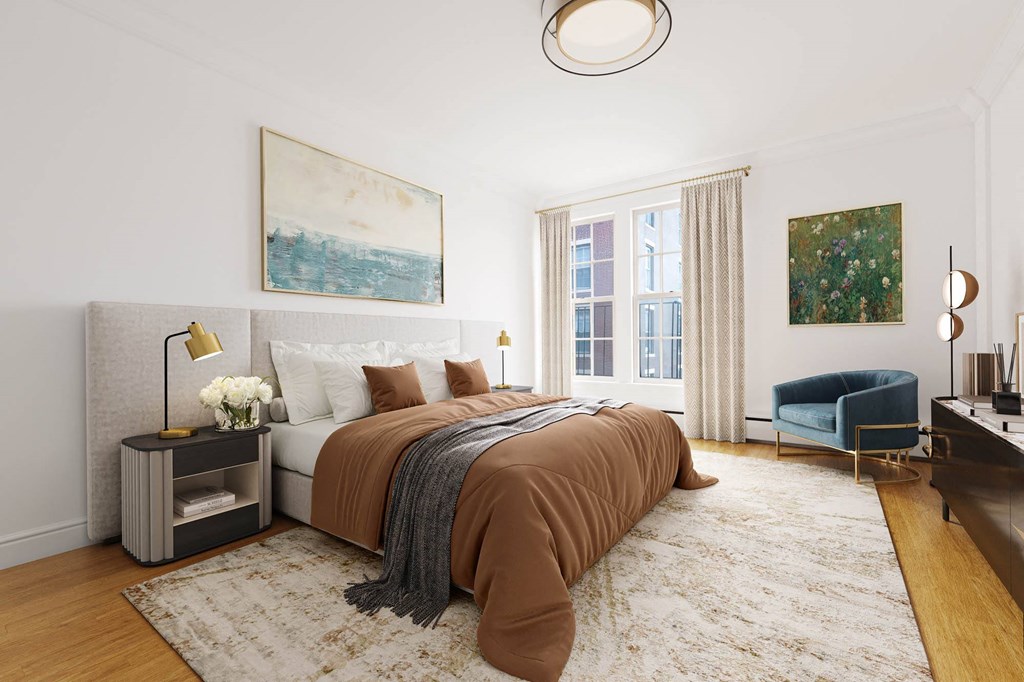 a bedroom with a bed and a chair