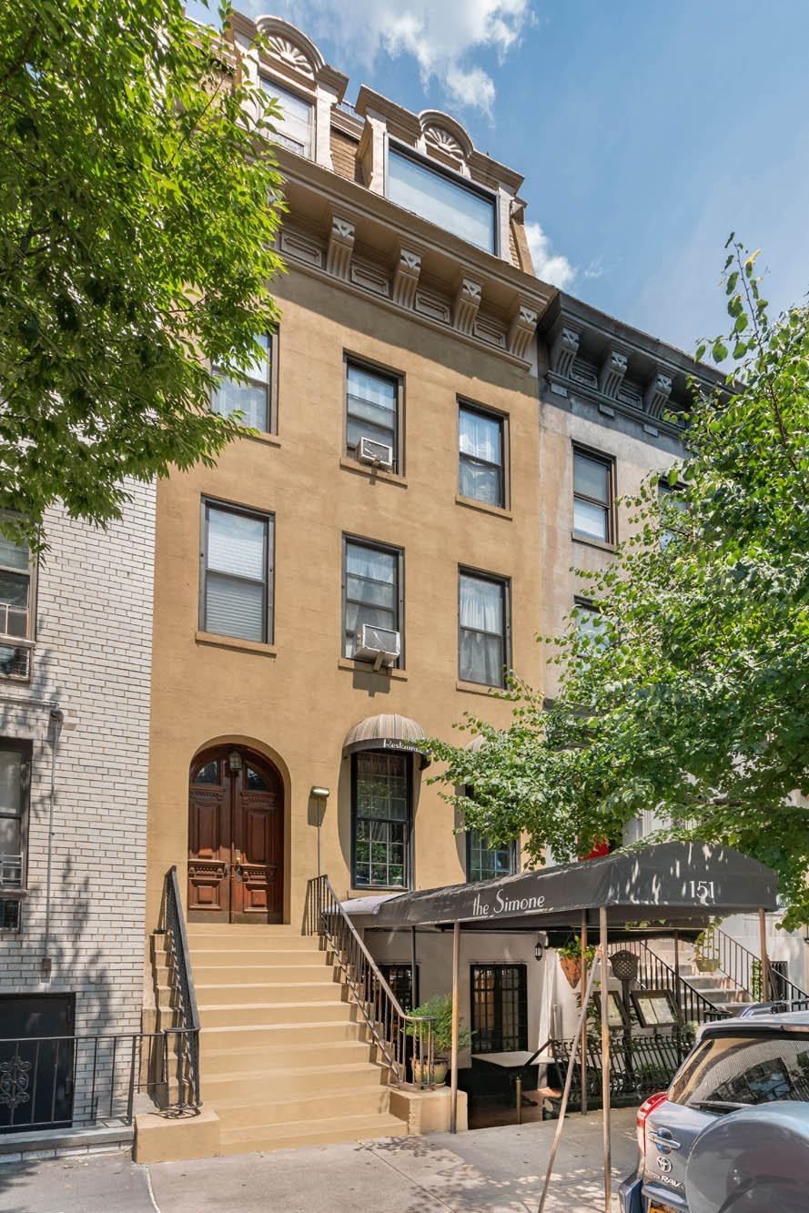 the apartment is on the top floor of a building with stairs