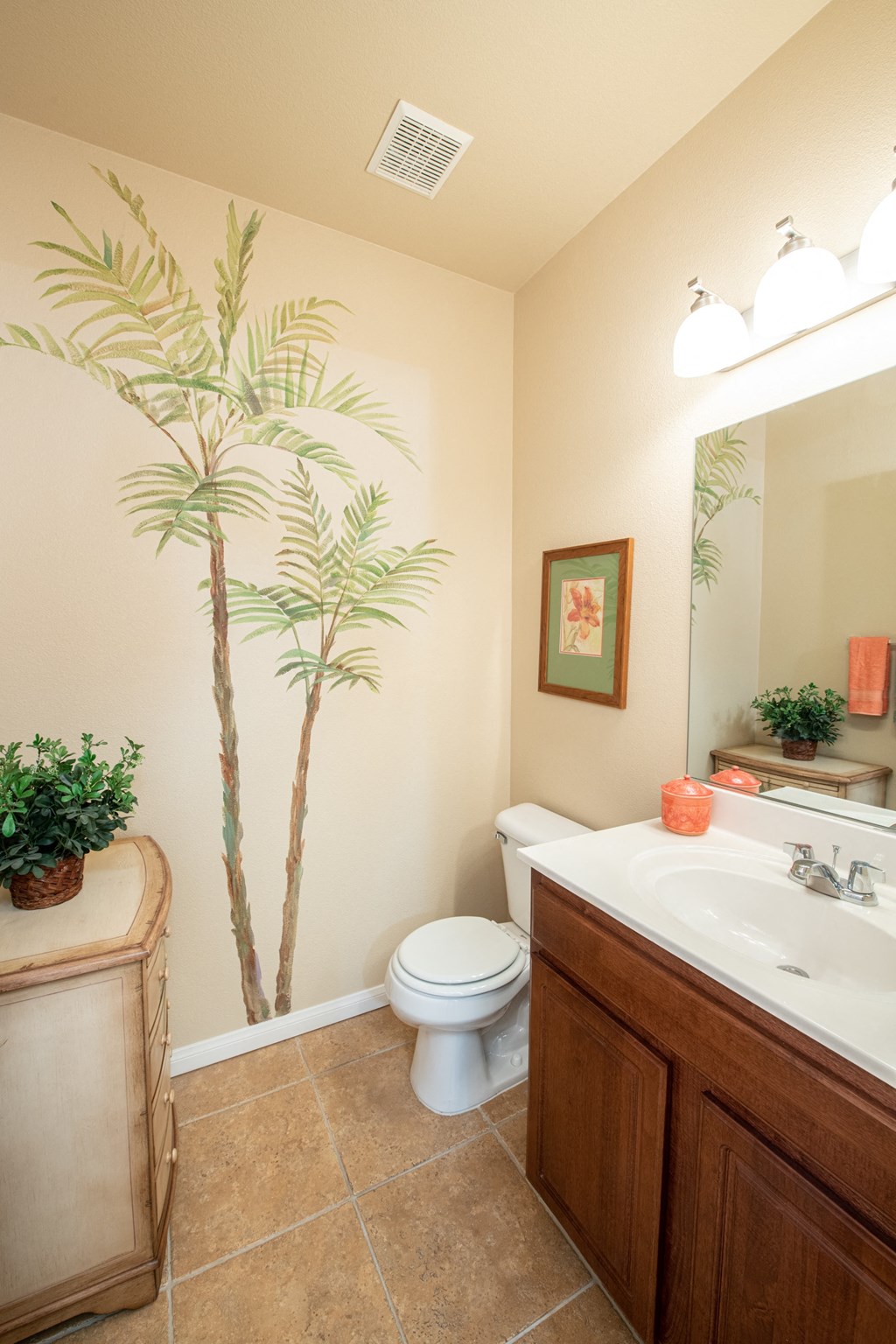 a bathroom with a toilet and a sink and a mirror