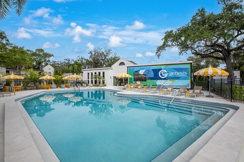 A large swimming pool with a Genesis sign in the background.