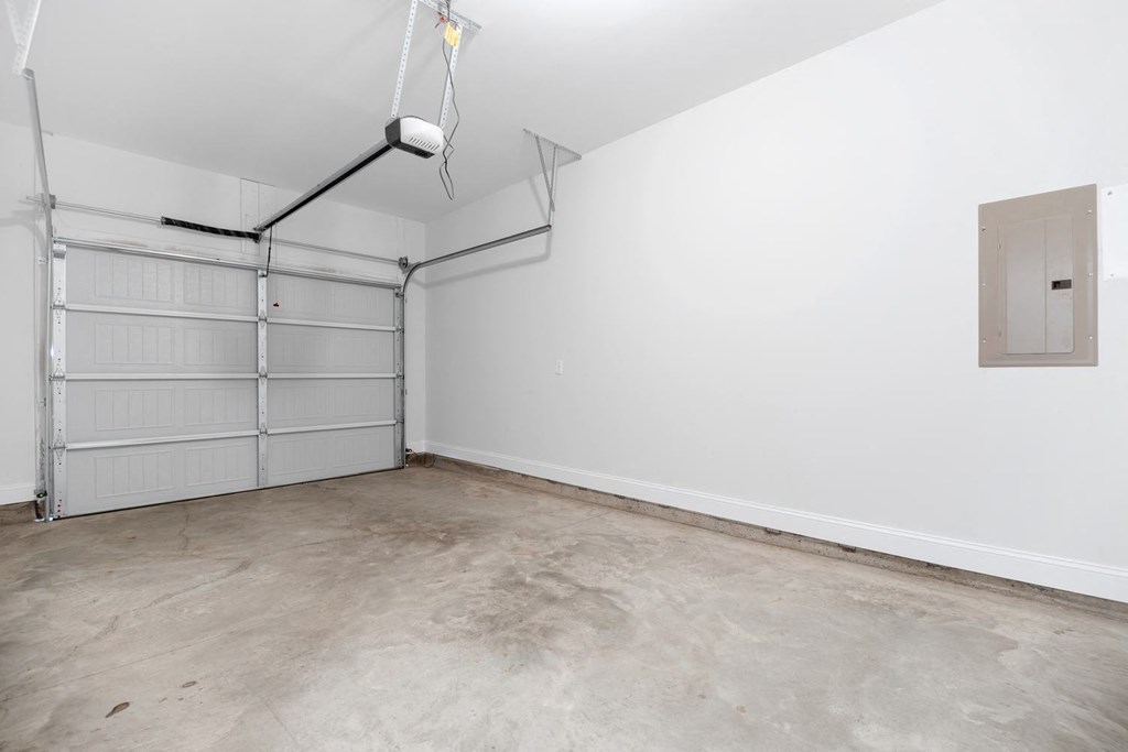 Cottonvale Towns in Savannah, GA photo of the interior of a garage with white walls and a garage door