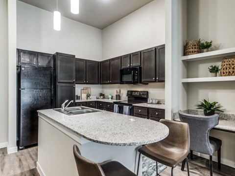 a kitchen with a counter top and a refrigerator
