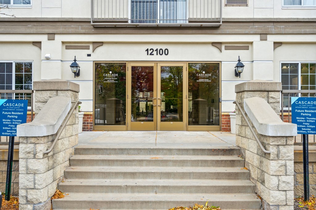 the front entrance of a building with steps