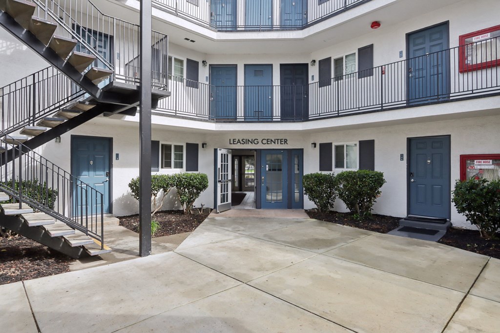 A building with a sign that says "LEASING CENTER" is shown.