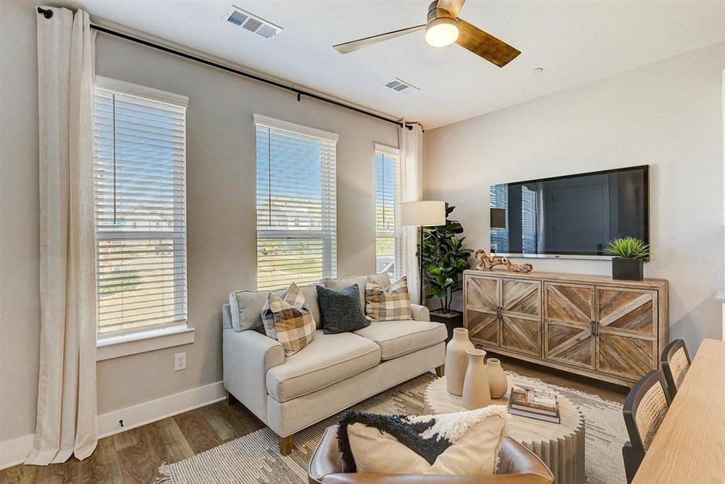 a living room with a couch and a tv
