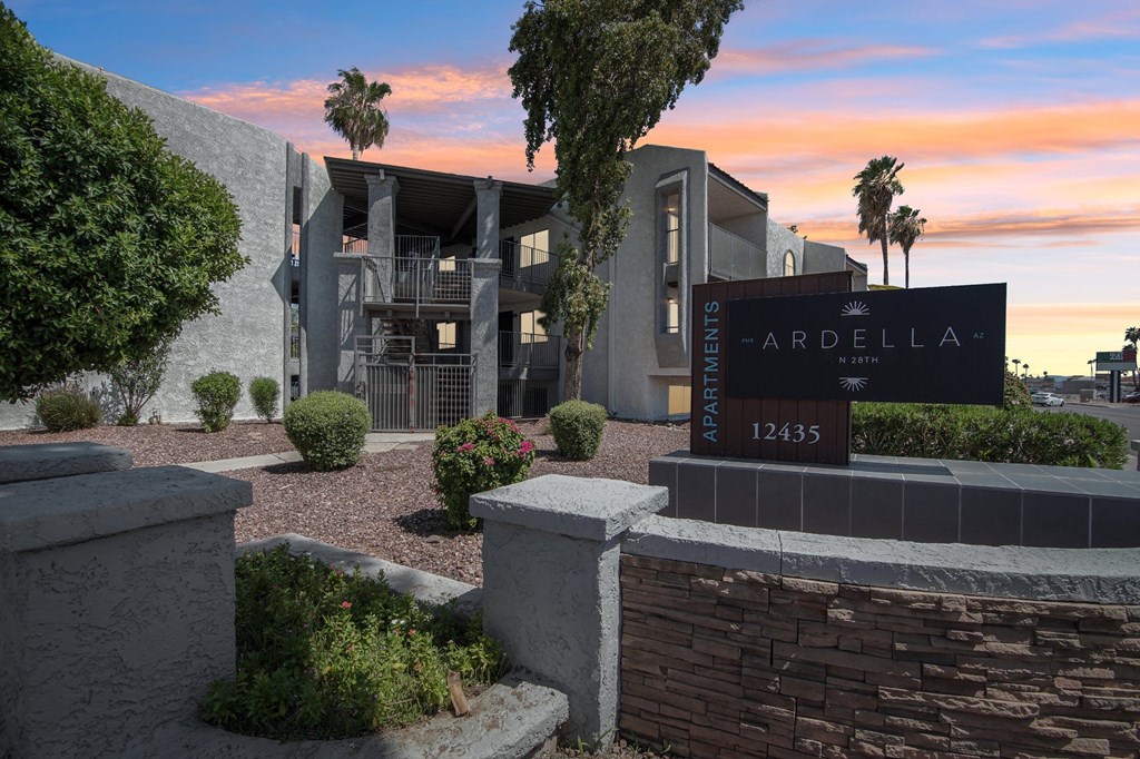 The image shows a modern building with a sign that reads "ARDELLA 12435".