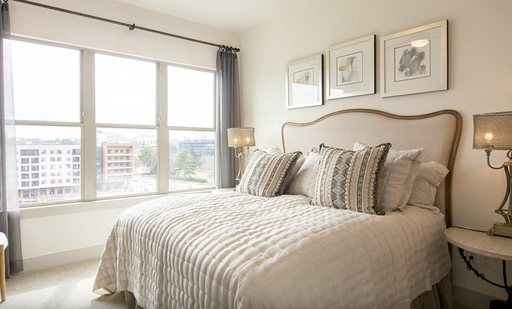 Pet-Friendly Apartments in Atlanta, GA - Arabelle Perimeter - bedroom with a bed and a large window