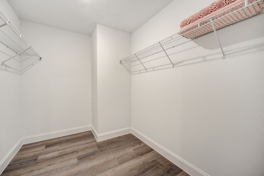Large closet with shelving at The Groves at Lake Ella in Lady Lake, Florida, a pet-friendly rental community.