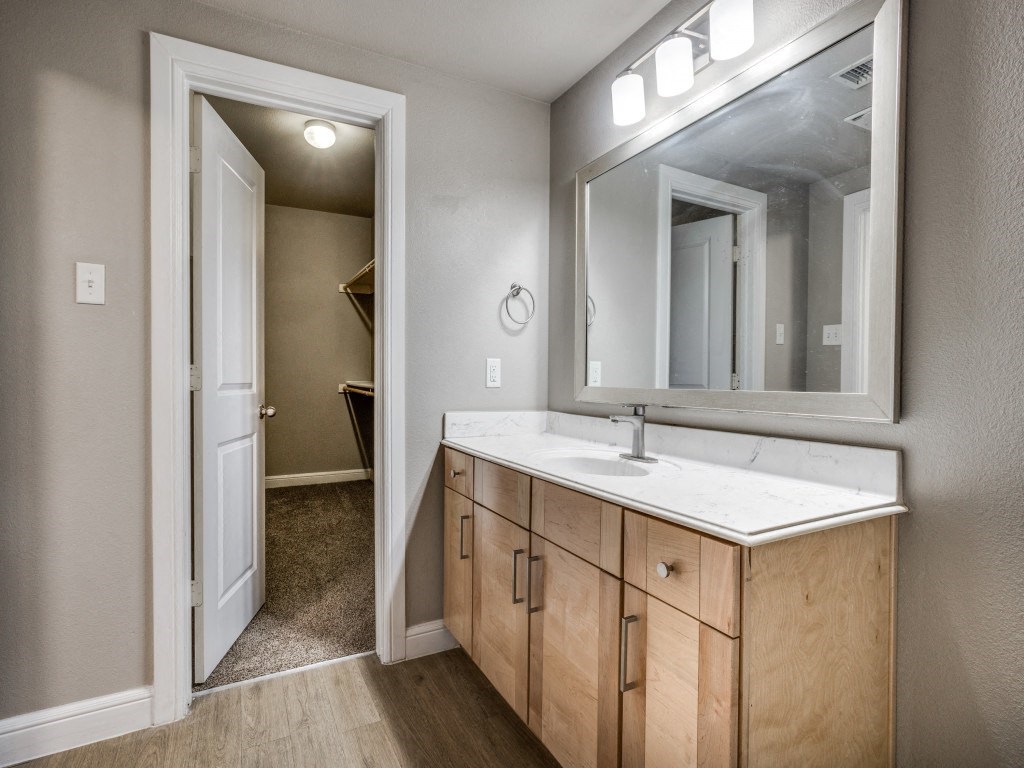 a bathroom with a sink and mirror