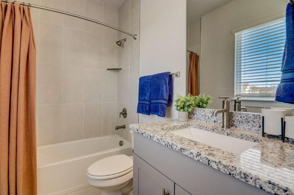 a bathroom with a sink toilet and a shower