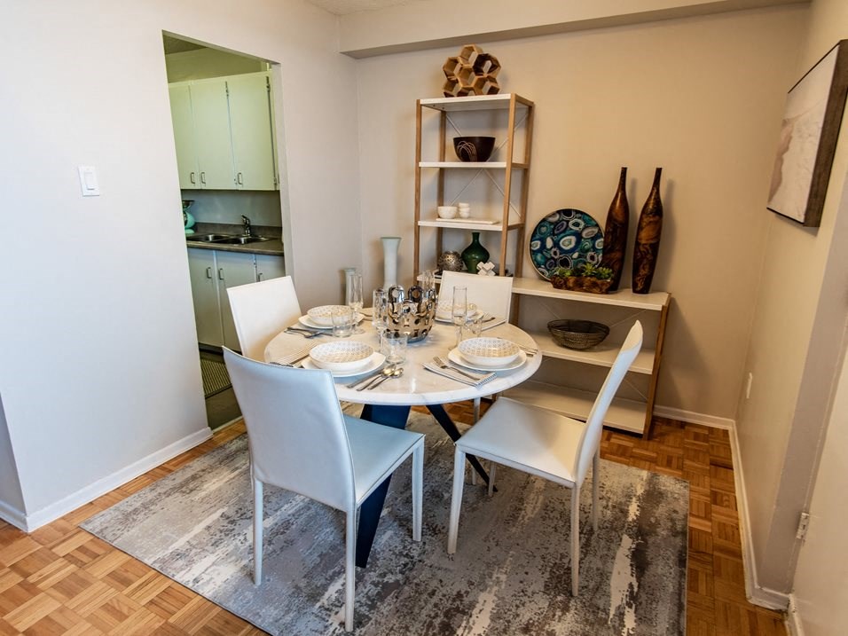 a dining room with a table and chairs