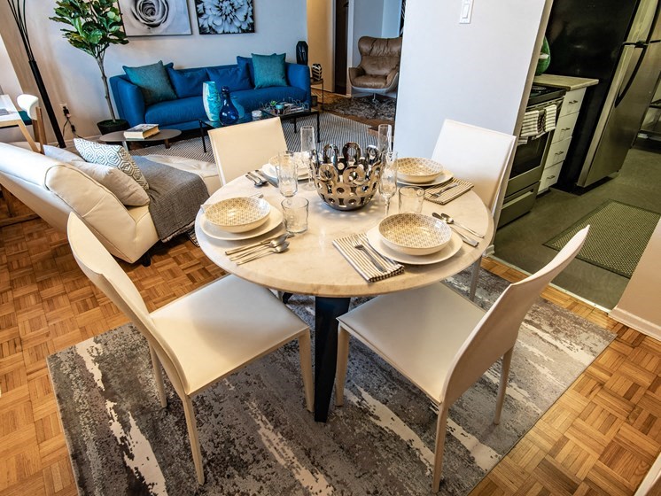 a dining room with a table and chairs and a living room