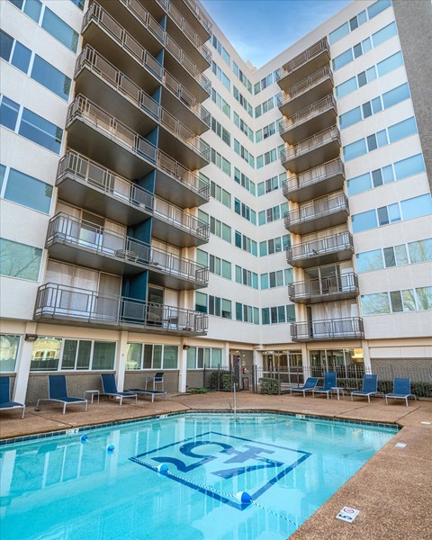 Resort-style pool at Idlewild 45 Apartments in Midtown Memphis surrounded by a high-rise courtyard