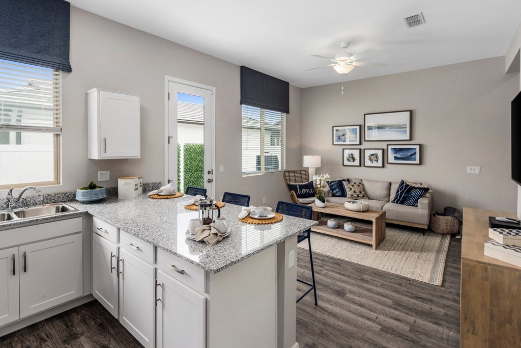 A kitchen with a dining area and a couch.