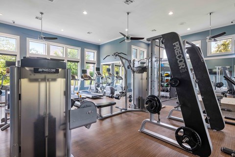 State-of-the-art fitness center at 33hundred Apartments in North Austin featuring cardio machines, free weights, and strength equipment