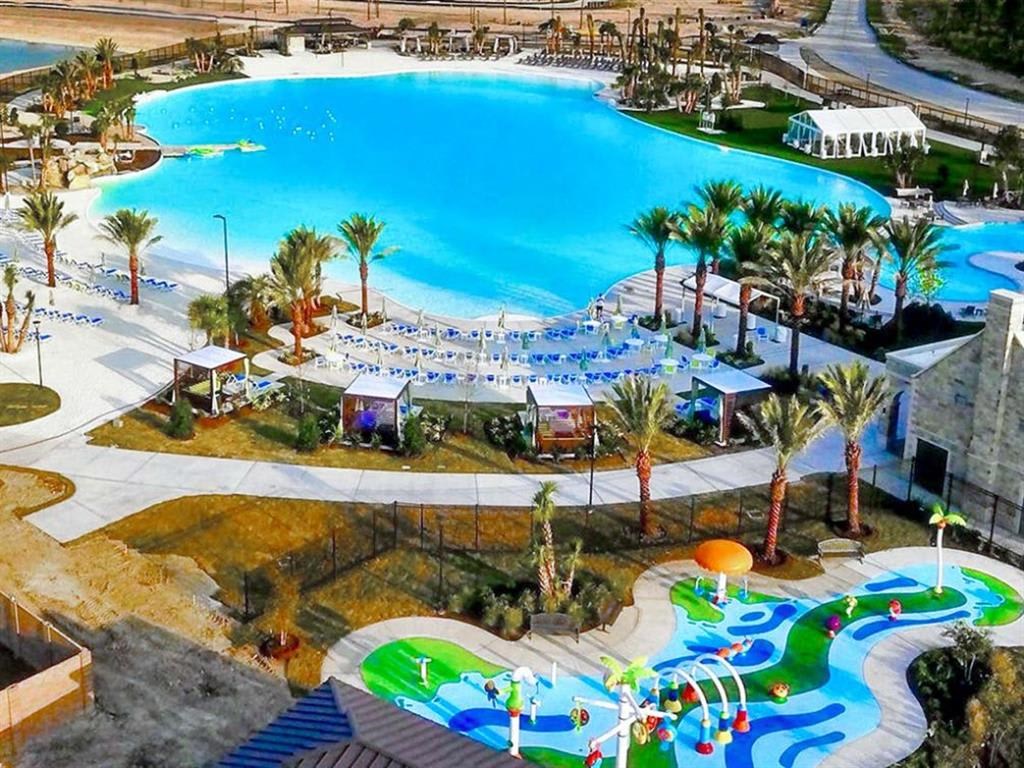 a large pool with a water park in the middle of it