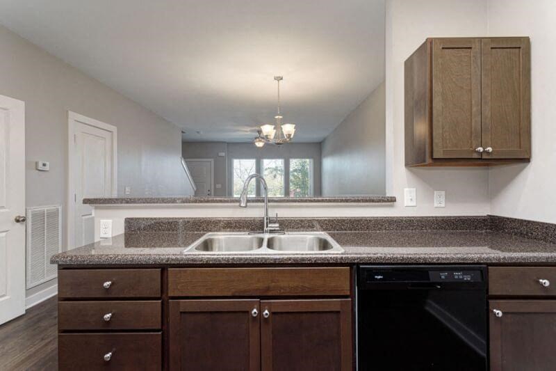 a kitchen with a sink and a window