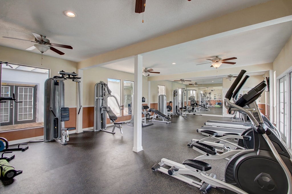 Derby Park Apartments in Daytona Beach, FL photo of with strength training machines.