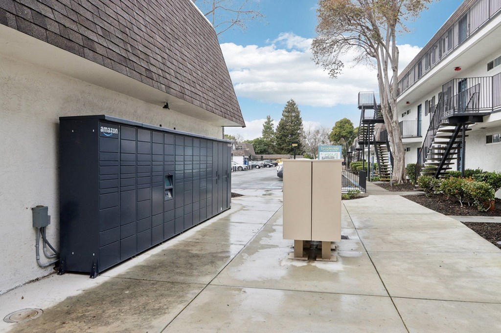 A black garage door is on the left and a white box is on the right.