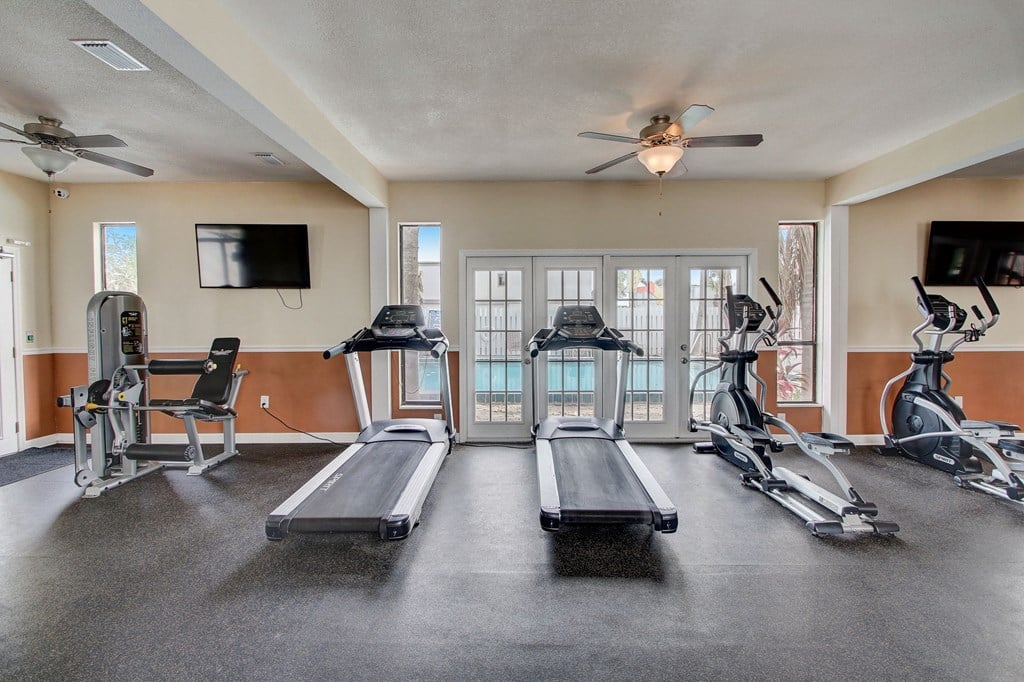 Derby Park Apartments in Daytona Beach, FL photo of fitness center with cardio equipment.