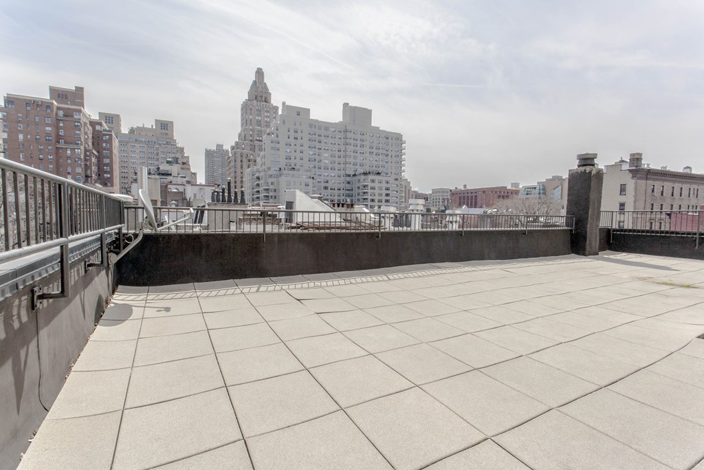 the view of the city from the roof of a building