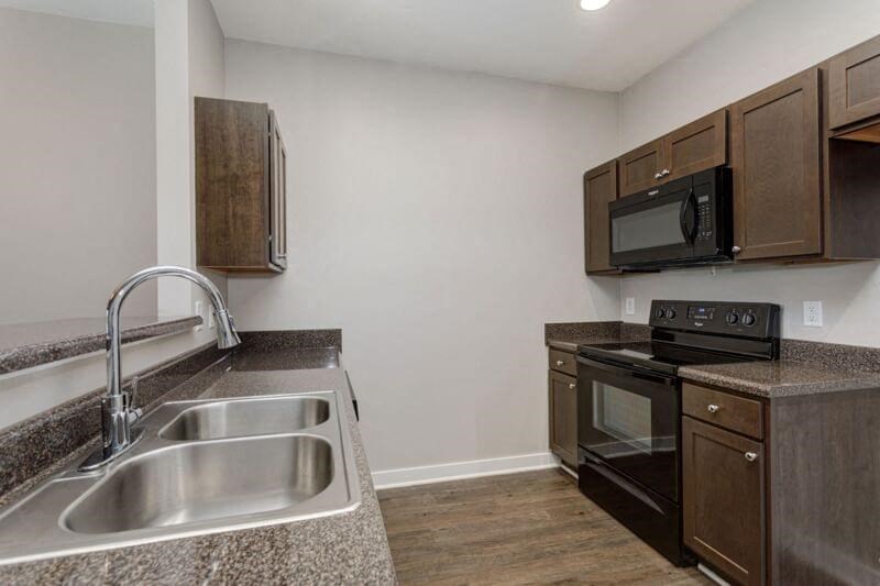 a kitchen with a sink and a stove