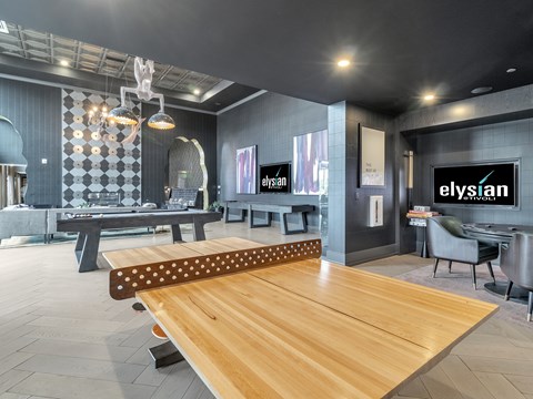A modern dining room with a wooden table and chairs.