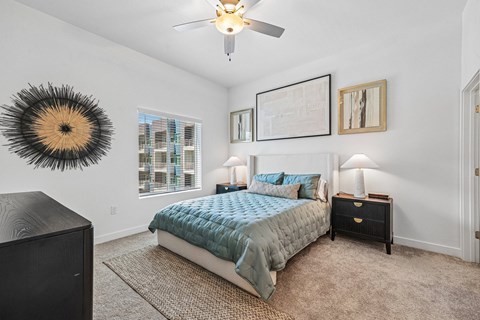 Spacious primary bedroom with contemporary finishes at Prosper 150 apartments in Las Vegas