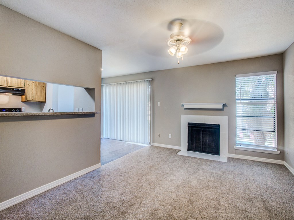 Magnolia Terrace apartments in Houston Texas 77082 photo of living room with plush carpeting and fireplace