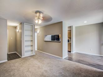 Magnolia Terrace apartments in Houston Texas 77082 photo of living room with built-in shelves - Photo Gallery
