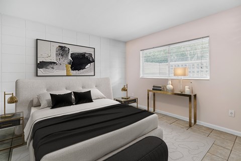 a bedroom with a bed and a window