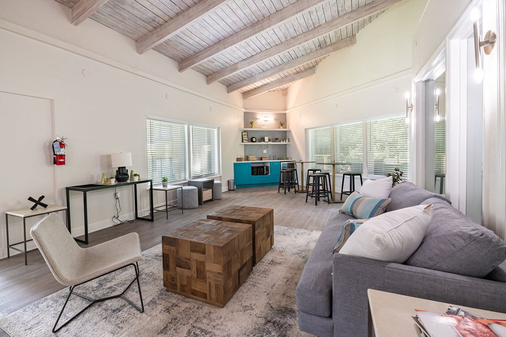 a living room with a couch and chairs