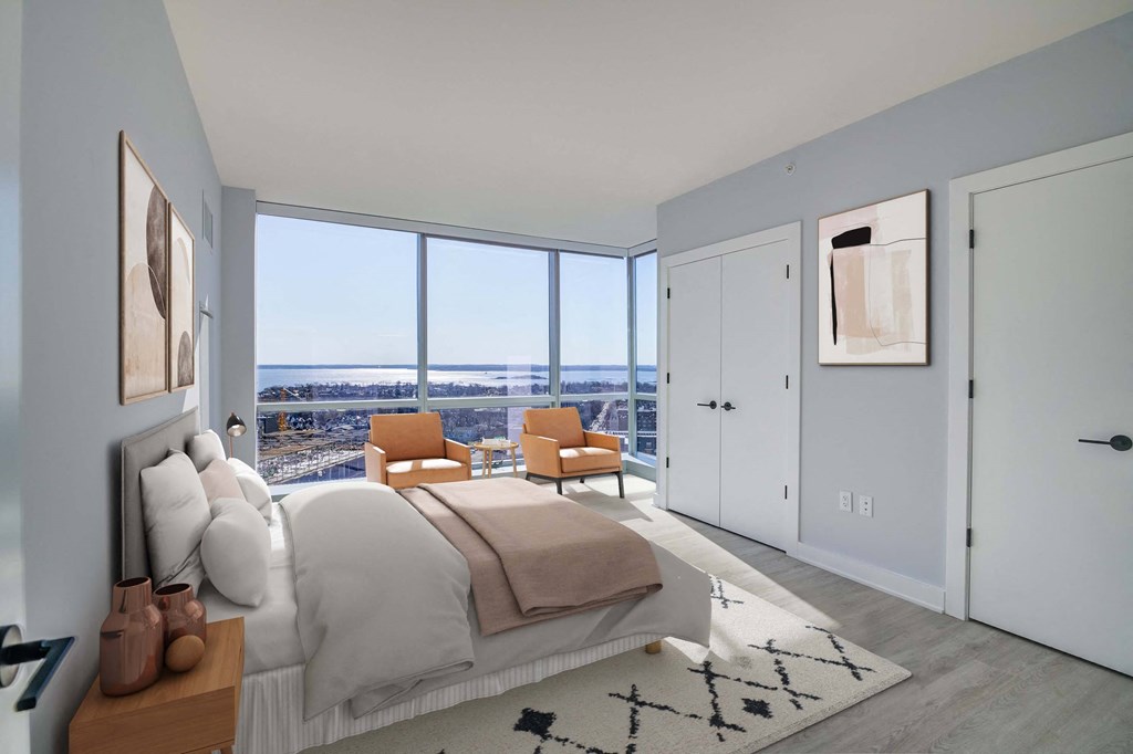 3thirty3 new rochelle ny apartment high rise photo of bedroom with large windows and modern furnishings