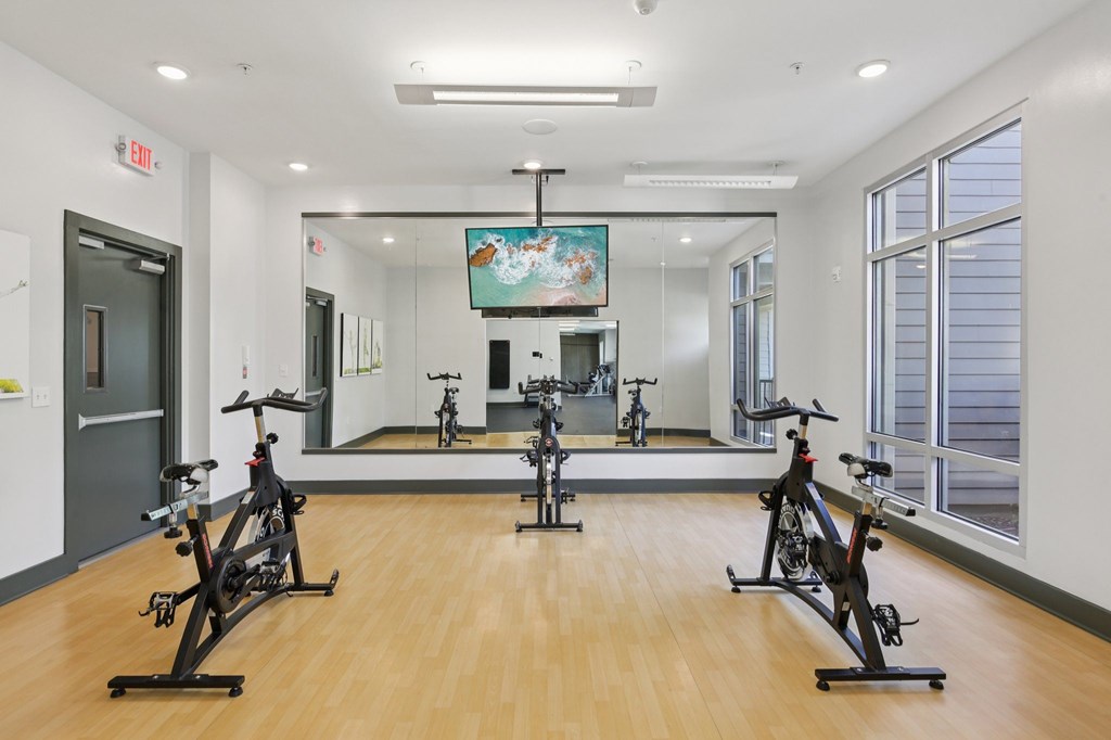 Exercise bikes lined up in the fitness center at Lotus at Starkey Ranch in Odessa, Florida.