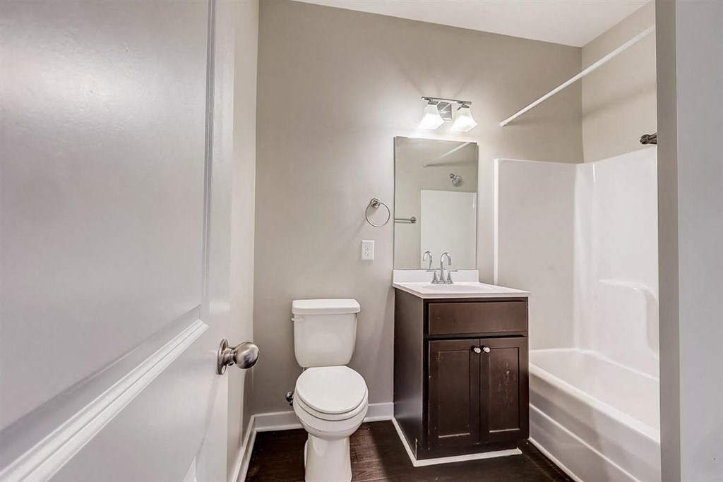 a bathroom with a toilet sink and bathtub