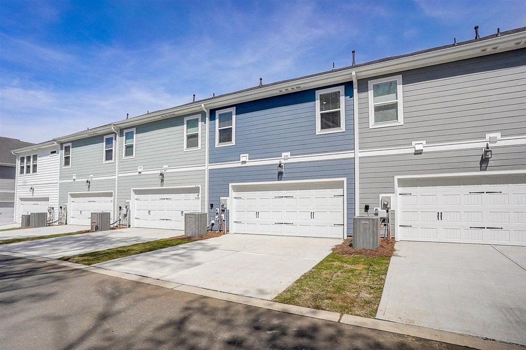 a blue house with a white garage door