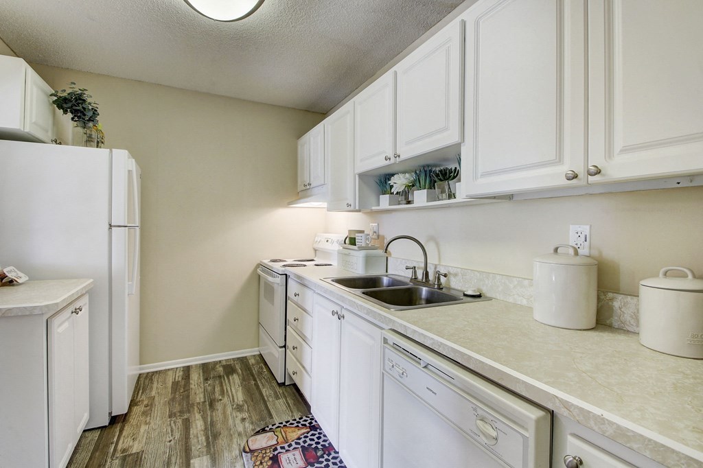 Derby Park Apartments in Daytona Beach, FL photo of a kitchen with white cabinets