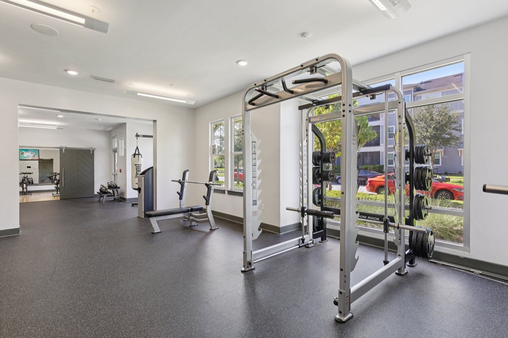 “Workout space with strength training equipment and mirrors at Lotus at Starkey Ranch in Odessa, Florida.