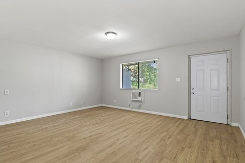 Element at 4411 Macon Apartments A room with a white door and a window with a view of trees.