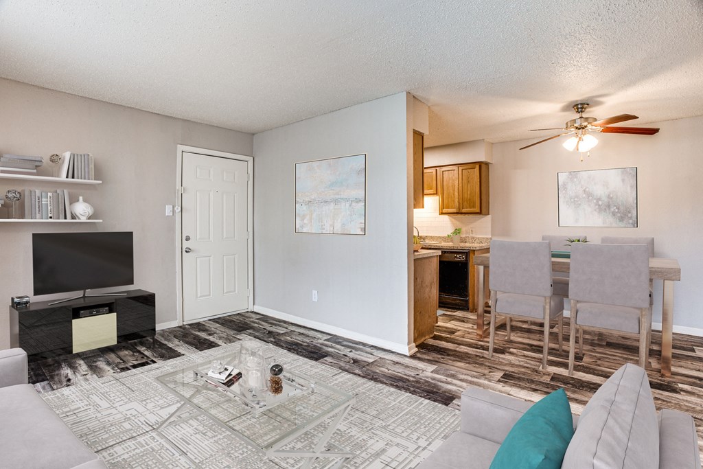 Open concept living room with dining area adjacent to the kitchen at Monarch Pass in Fort Worth, Texas, near South Fort Worth.