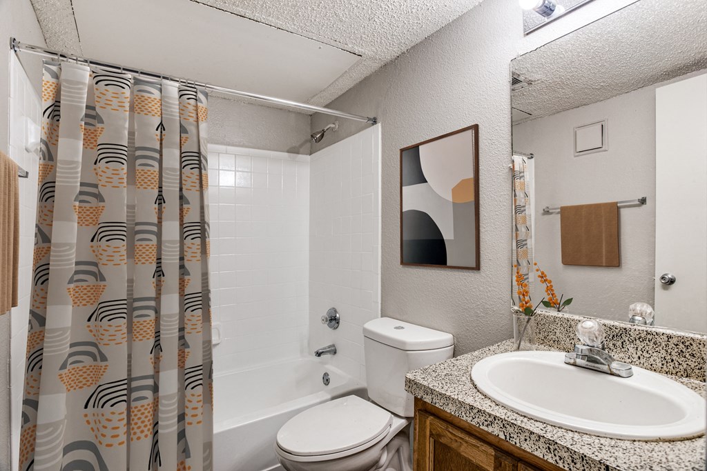 Bathroom with tub and shower at Monarch Pass in Fort Worth, Texas, near South Fort Worth.