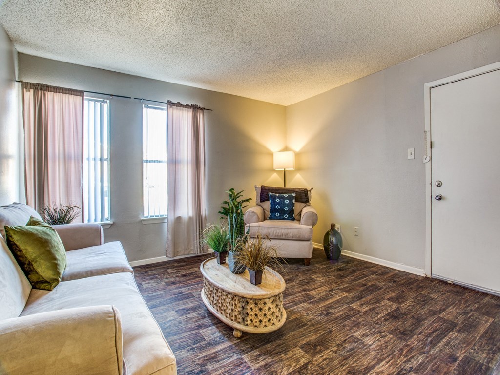 Monarch Pass Apartments in Fort Worth, TX photo of living room with tall windows