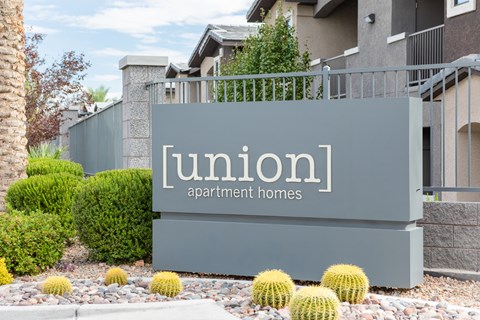 the entrance to a building with a sign that reads apartment homes