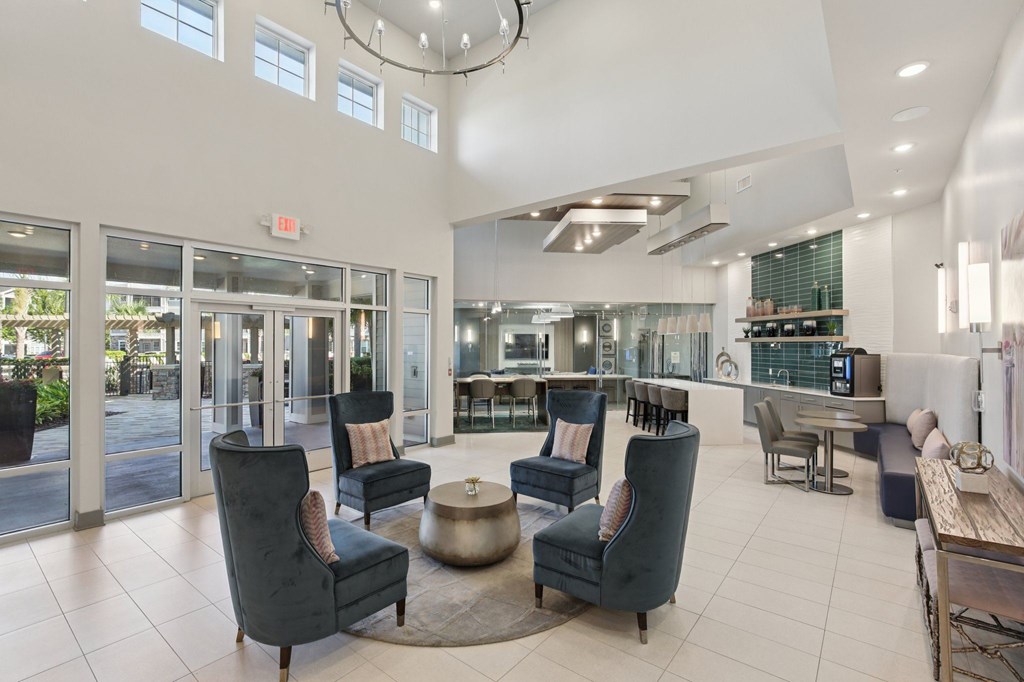 A large, modern living room with a circular coffee table at the center.