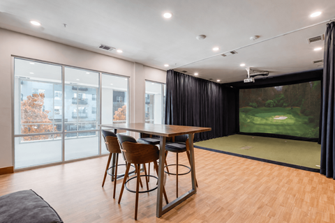 A modern dining room with a large table and chairs.