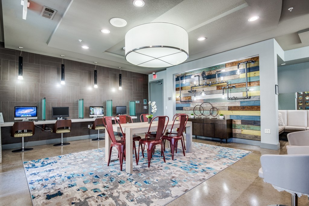 a conference room with a white table and chairs and a tv